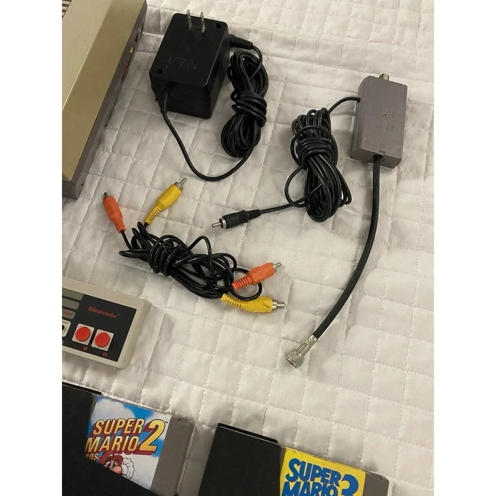 authentic NES Console Bundle with Super Mario Bros. 1,2,3 and 2 Controllers gun